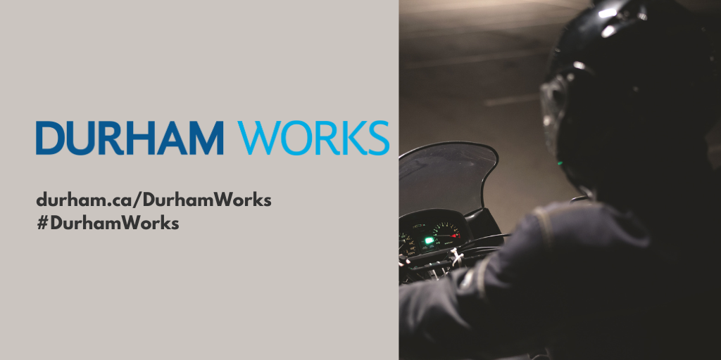 Close-up stock image of a motorcyclist. Text states, “Durham Works. Durham.ca/DurhamWorks #DurhamWorks”
