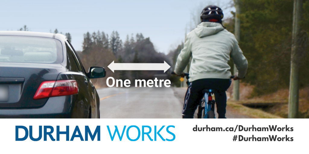 Image of a person riding a bike next to a car with an arrow in between and the words, “One metre.” Text under image states, “Durham Works, durham.ca/DurhamWorks, #DurhamWorks.”
