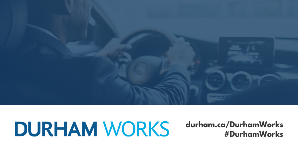 Image shows a man driving with a dark blue filter over the image. Text under image states: “Durham Works, durham.ca/DurhamWorks #DurhamWorks.”