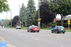 cars on road with traffic light in backgorund