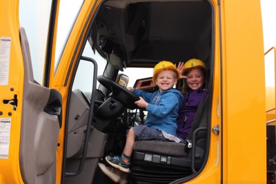 Children smiling in big truck