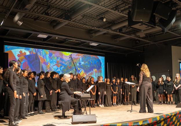 the Concordia Concert Choir performing on stage.