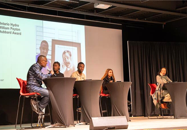 Panelists speaking at the Together Against Hate Durham Conference