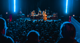 A band takes center stage at the Biltmore Theatre.