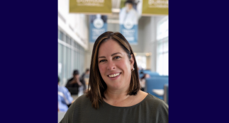 A head shot of Amber with a blurred background.