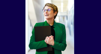 A head shot of Dr. Elaine Popp with a blurred background.