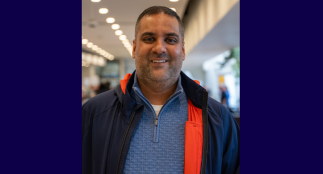 A head shot of Muaz with a blurred background.