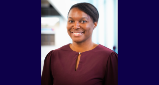 A head shot of Shenelle with a blurred background.