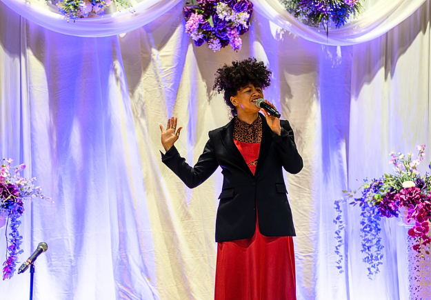 A speaker on stage at the event.