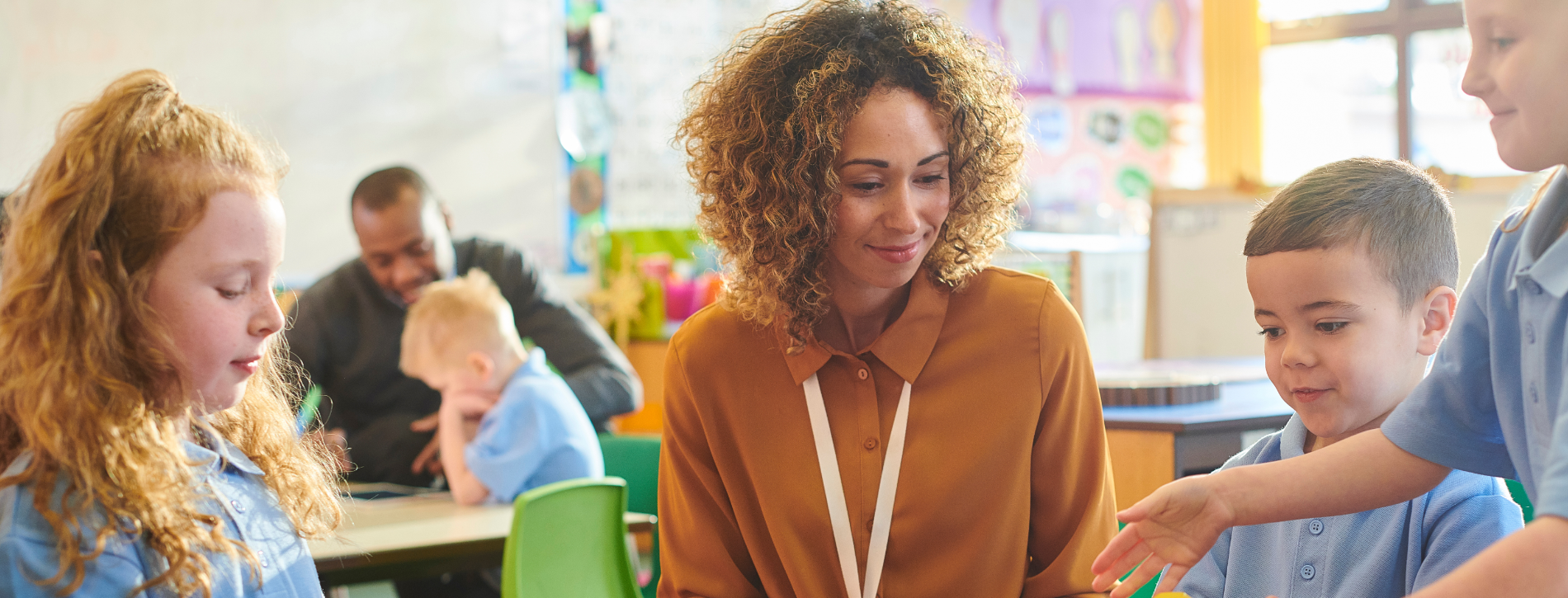 Educators and students in a classroom.