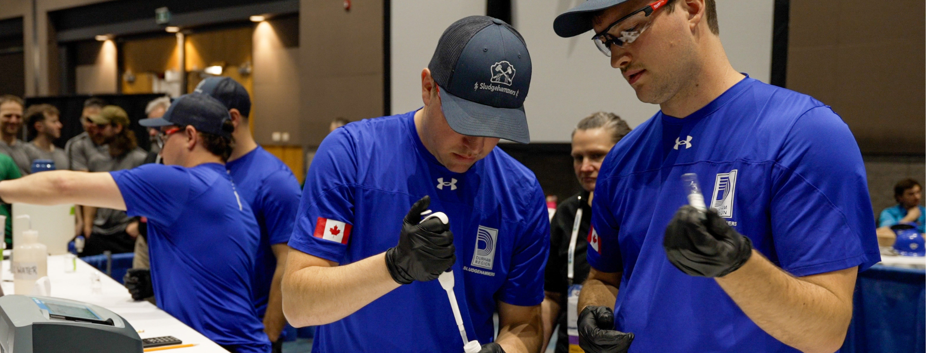 A photo of five Durham Region’s Sludgehammer team members in blue shirts.