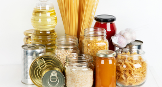 Jars of various sizes containing different food items like pasta, grains and sauce.