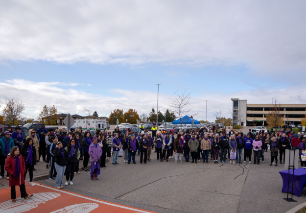 A group of participants listening to remarks at the IPV Walk.