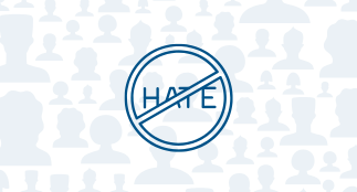 The word hate with a strikthrough symbol overtop. Head and shoulder silhouettes are in the background 