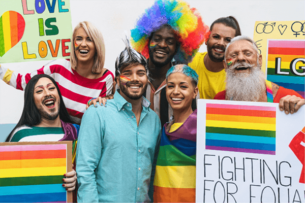 group of people smiling at Pride