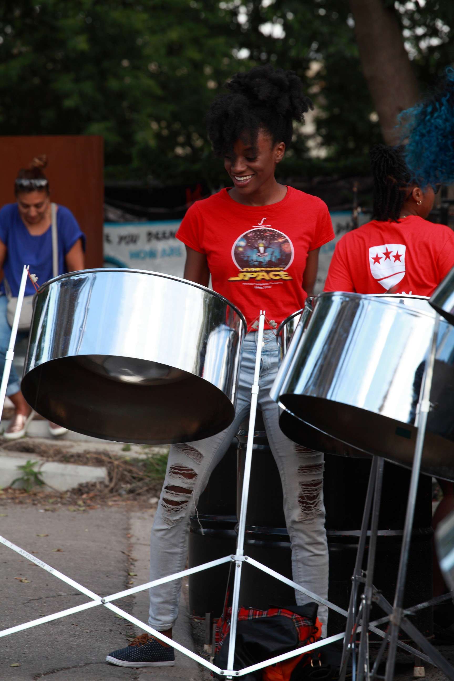 Image of a person playing a steelpan