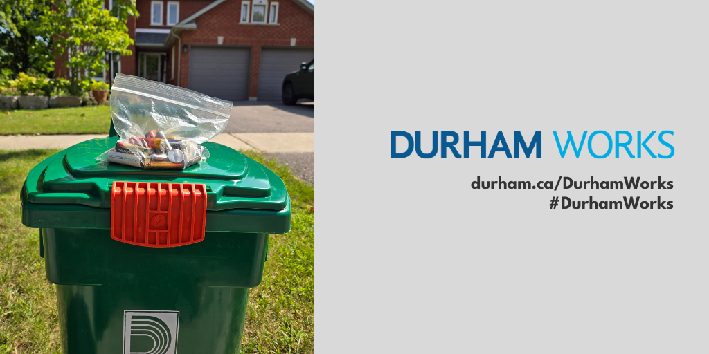 A picture of batteries on top of a green bin