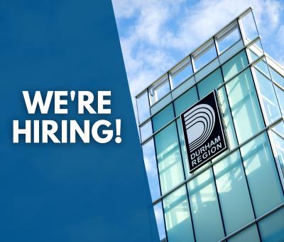 Photo of Durham Region logo on building. Blue banner with white text reads we're hiring