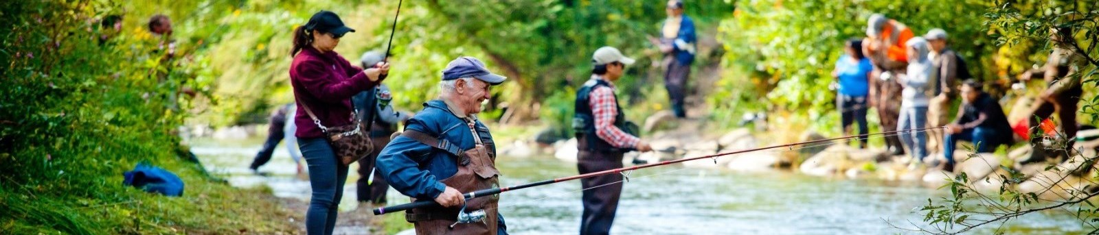 people fishing in a river