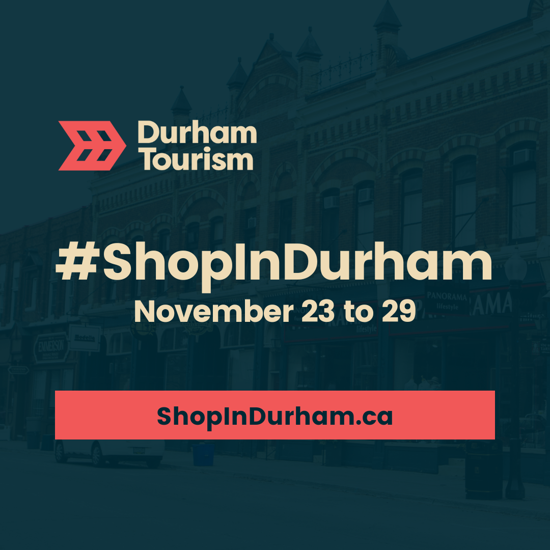 Storefronts in downtown Port Perry with a navy-blue filter, Durham Tourism logo and text that reads, “#ShopInDurham, November 23 to 29, Shop in Durham.ca.