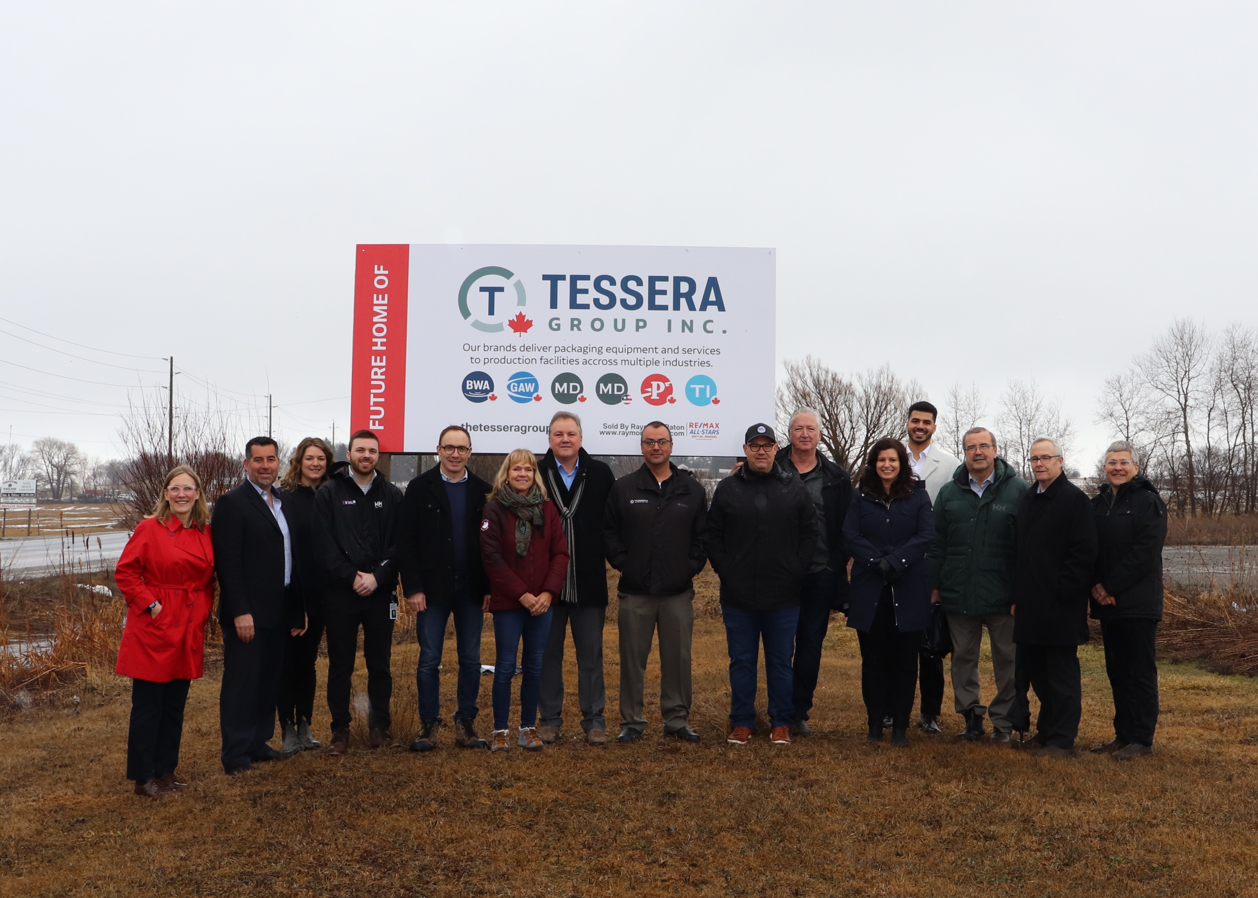 Regional Chair John Henry, Mayor Wotten of Scugog, Tessera Group Inc. and Regional Economic Development staff standing in front of the Tessera Group’s new sign on their newly purchased lot in Scugog