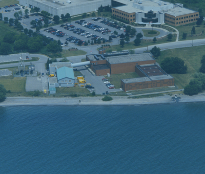 A photo of the Whitby Water Supply Plant and waterfront trail with a dark blue filter over it.