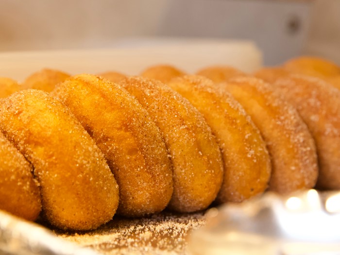 A photo of a collection of freshly baked Tyrone Mill apple cider donuts