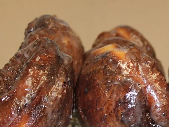 A photo of two White Feather Country Store apple fritters