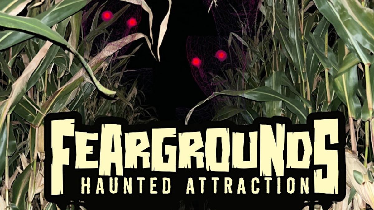 Graphic of scare actor in a corn field with text that reads, "Feargrounds Haunted Attraction"