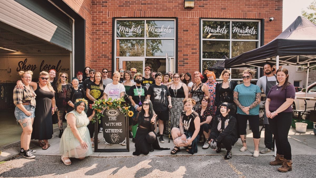 Group of people smiling at The Gathering event at Markets Ontario in Bowmanville, Ontario, Canada