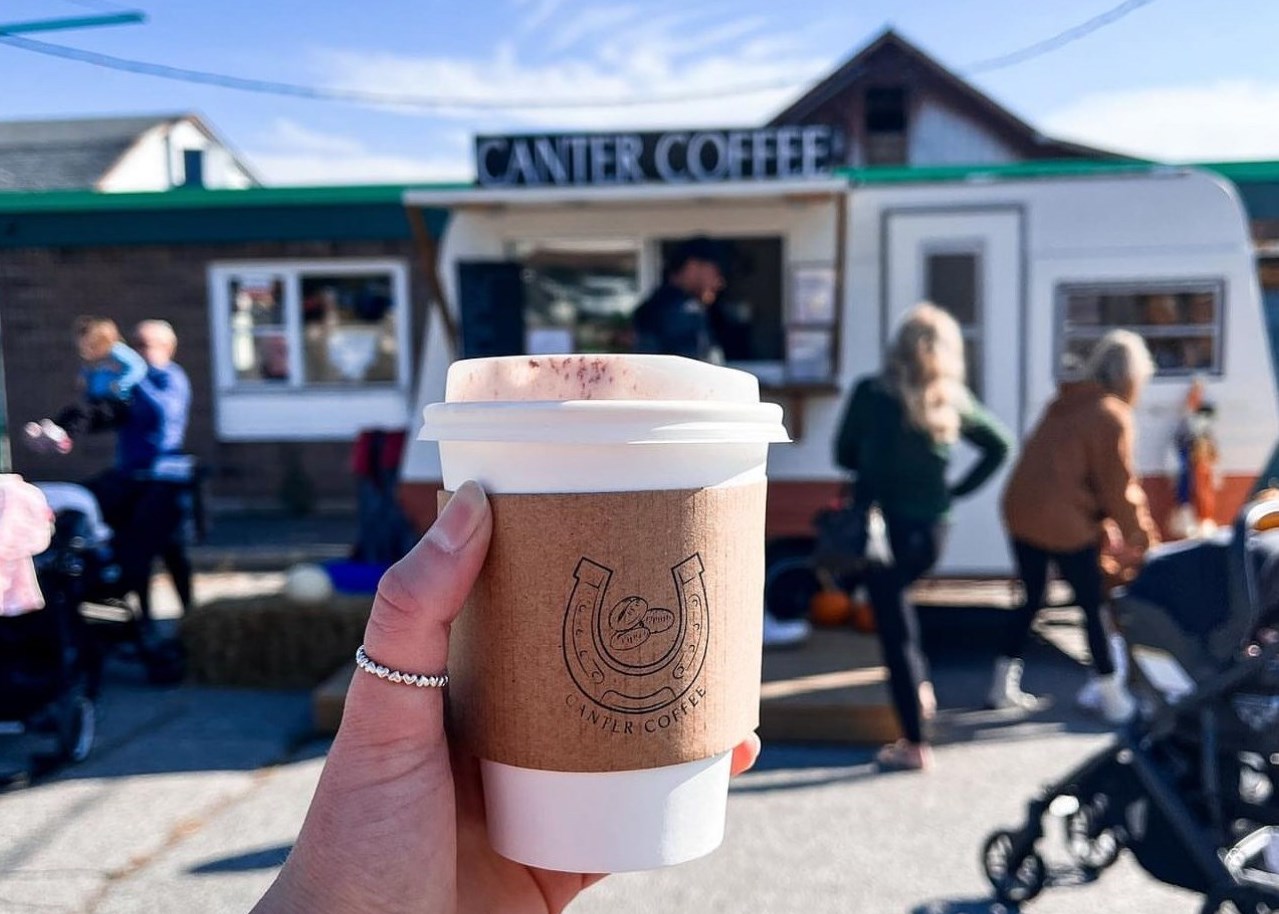 Hand holding a coffee from Canter Coffee in Sunderland