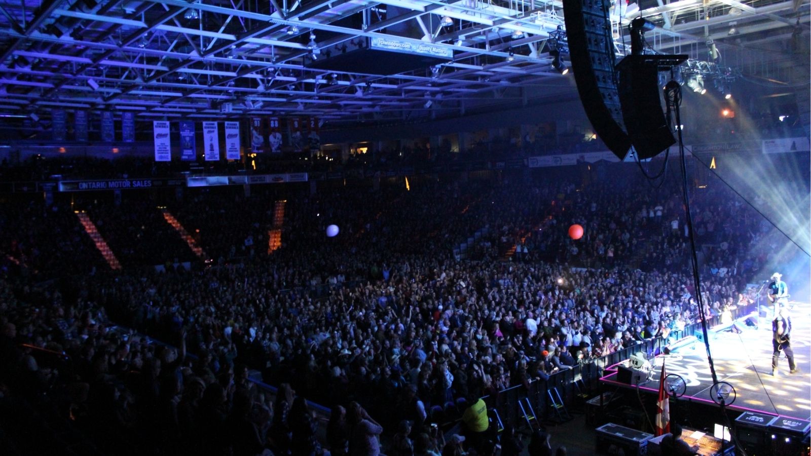 Image from a large concert at Tribute Communities Centre that shows the performer on stage in front of the audience