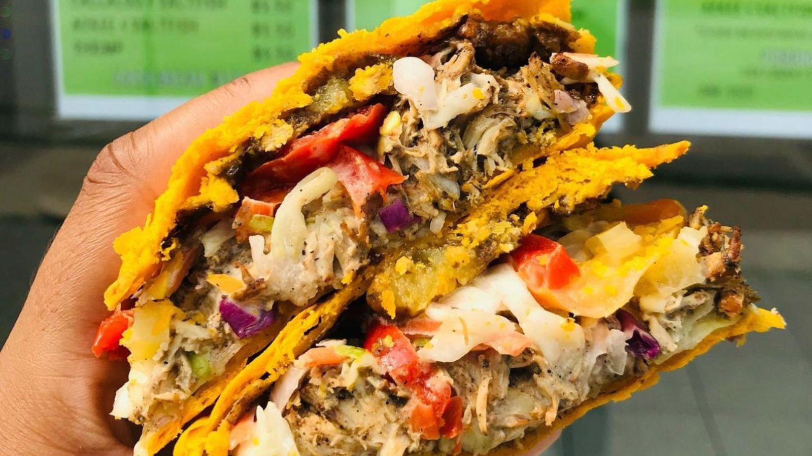 Hand holding a Jamaican patty from Patty Gyal in Ajax, Ontario