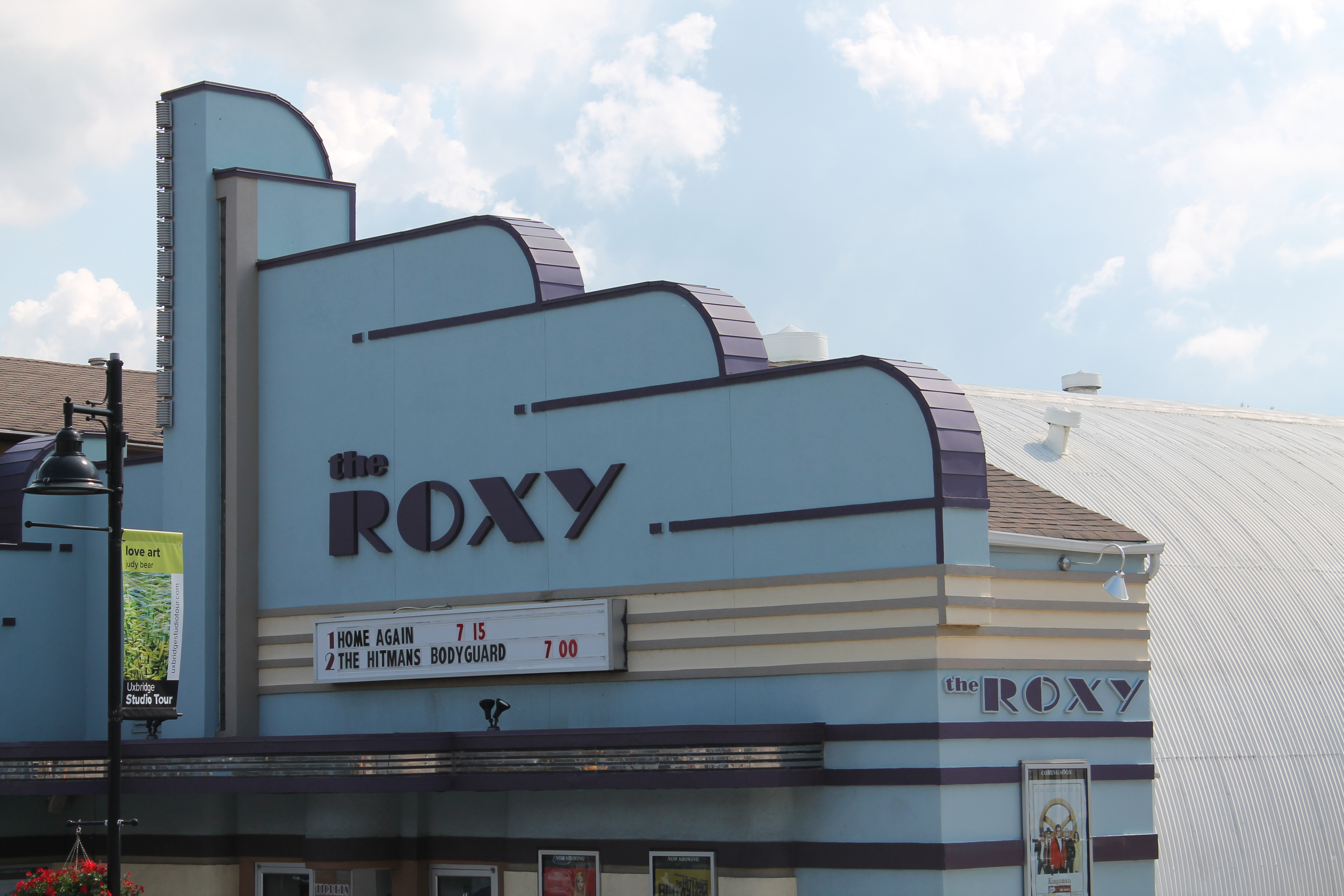 Photo of the exterior of an old school movie theatre