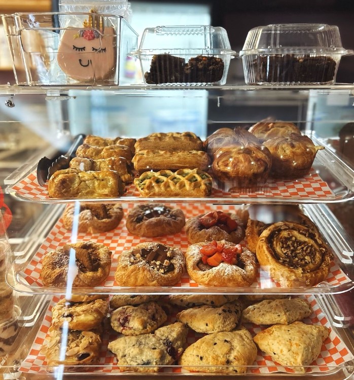 Image of a showcase full of pastries, scones, and cookies