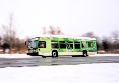Durham Region Transit bus driving on a snowy road in Durham Region, Ontario, Canada