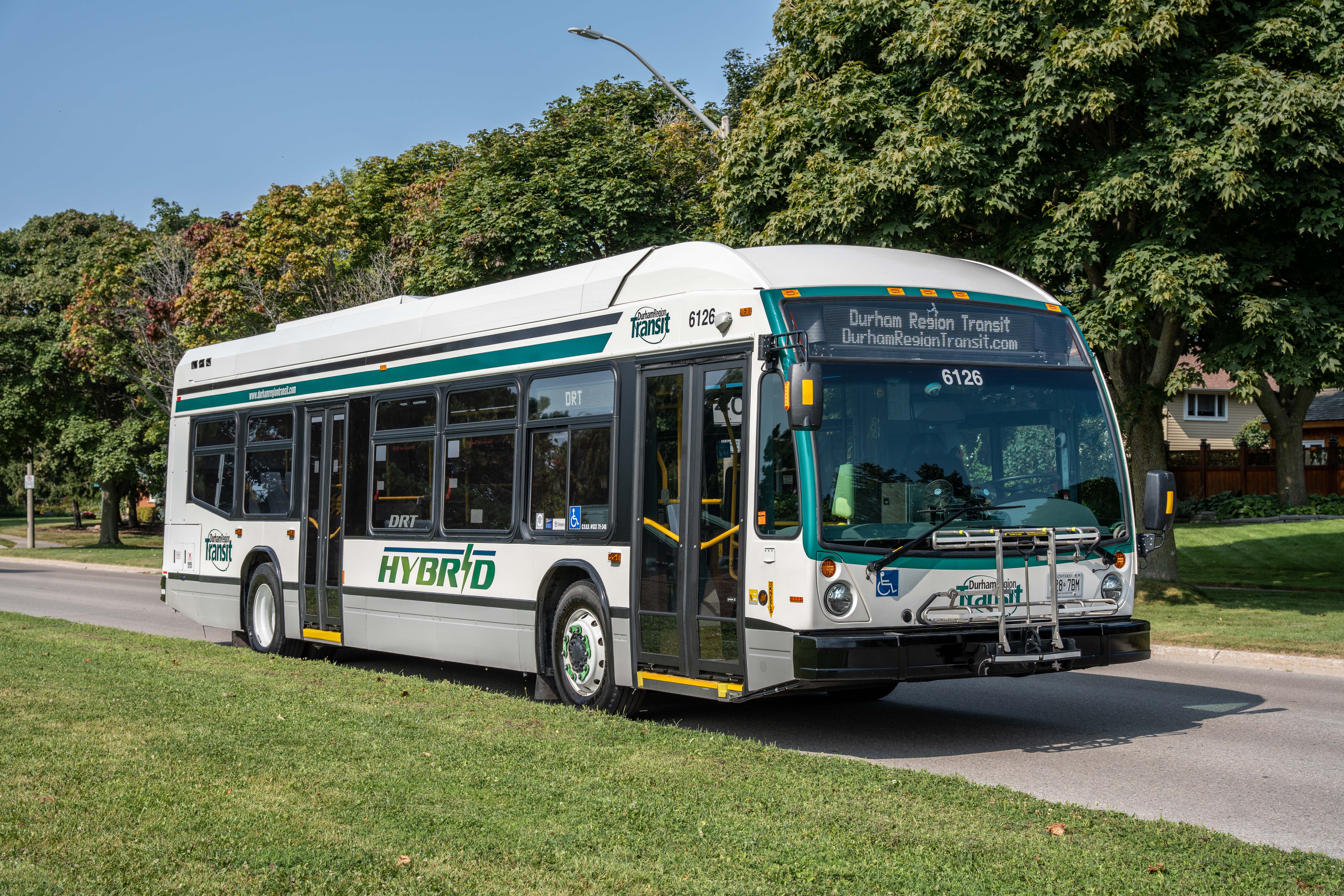 A Durham Region Transit (DRT) bus driving along a street in Durham Region, Ontario, Canada.