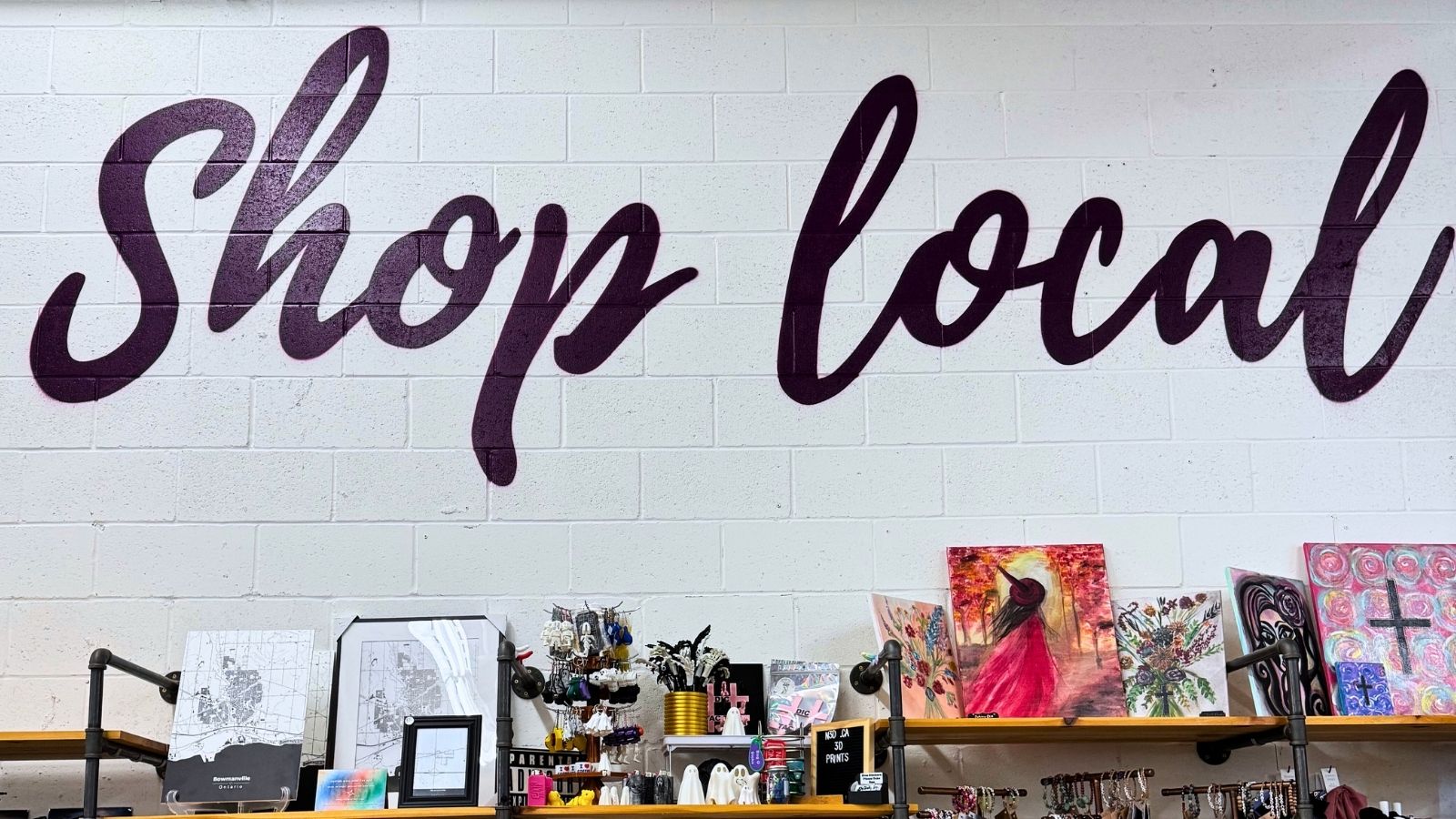 Sign that reads "Shop Local" at Markets Ontario in Bowmanville, Ontario