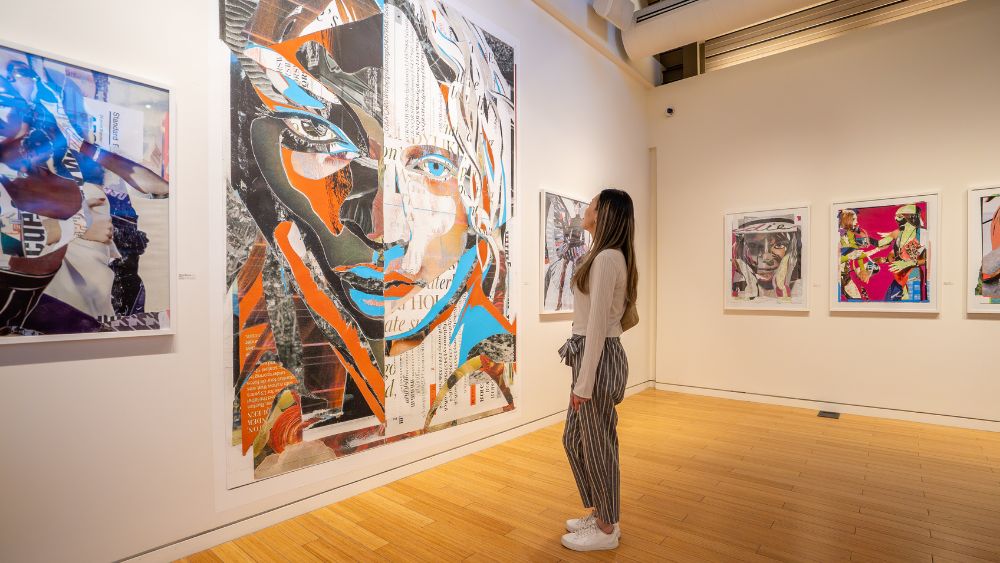 Person looking at art at Station Gallery in Whitby, Ontario, Canada