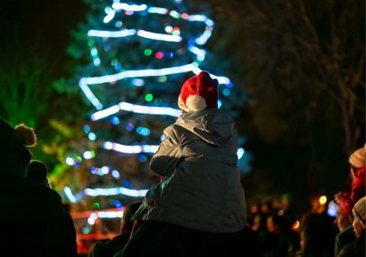 Child on parent's shoulders at Winter Wonderland in Pickering, Ontario