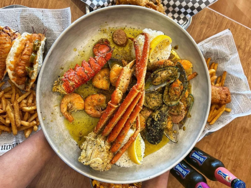 Close up of a seafood medley on a plate.