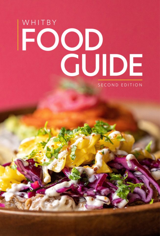 Close up of a taco with text that reads, "Whitby Food Guide Second Edition.".