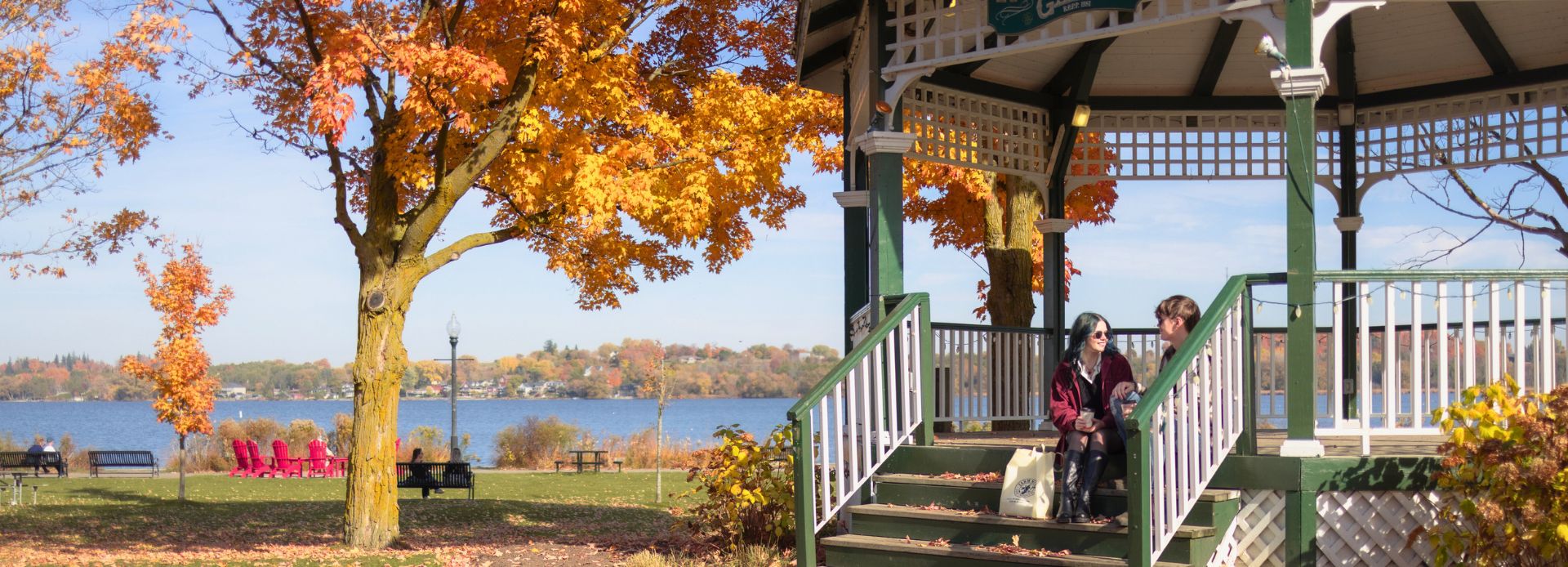 Couple sitting under a gazebo in downtown Port Perry, Ontario, Canada.