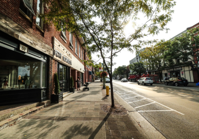 Image of a sunny main street in a small town