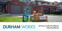  picture of a bike and a box of items marked as free on the curb of a residential home, with the Durham Works logo and text reading durham.ca/DurhamWorks #DurhamWorks 
