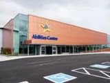 The outside of the Abilities Centre with the organization sign that includes the logo and text that reads Abilities Centre