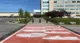 An Orange crosswalk with mocassins in front of Durham Regional Headquarters