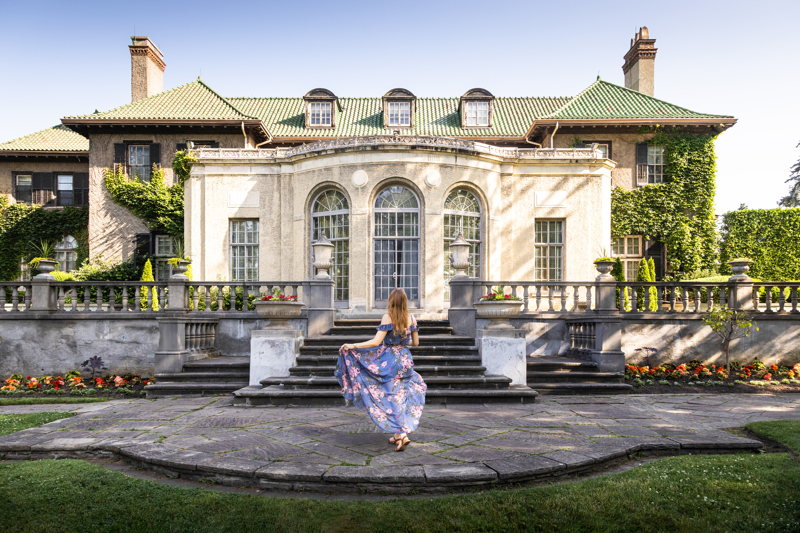 Woman in long dress looking at Parkwood Estate.