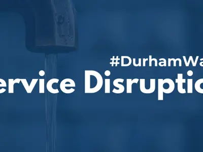 A photo of a running water tap with a blue filter over it and white text reading #DurhamWater Service Disruption 