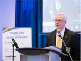 Regional Chair and CEO, John Henry, speaking at a podium
